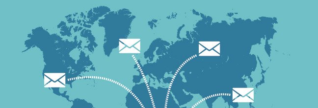Email icons against map of the world